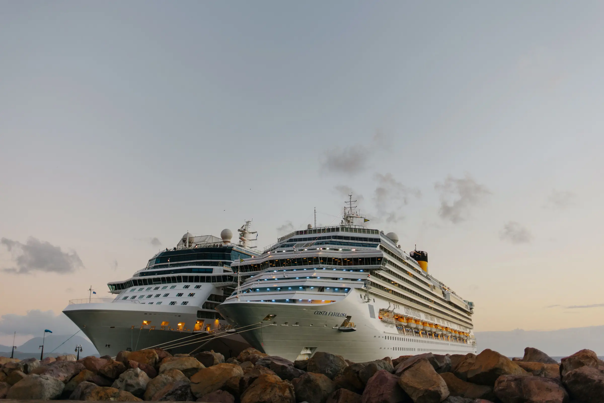 Two ocean cruise ships docked side by side