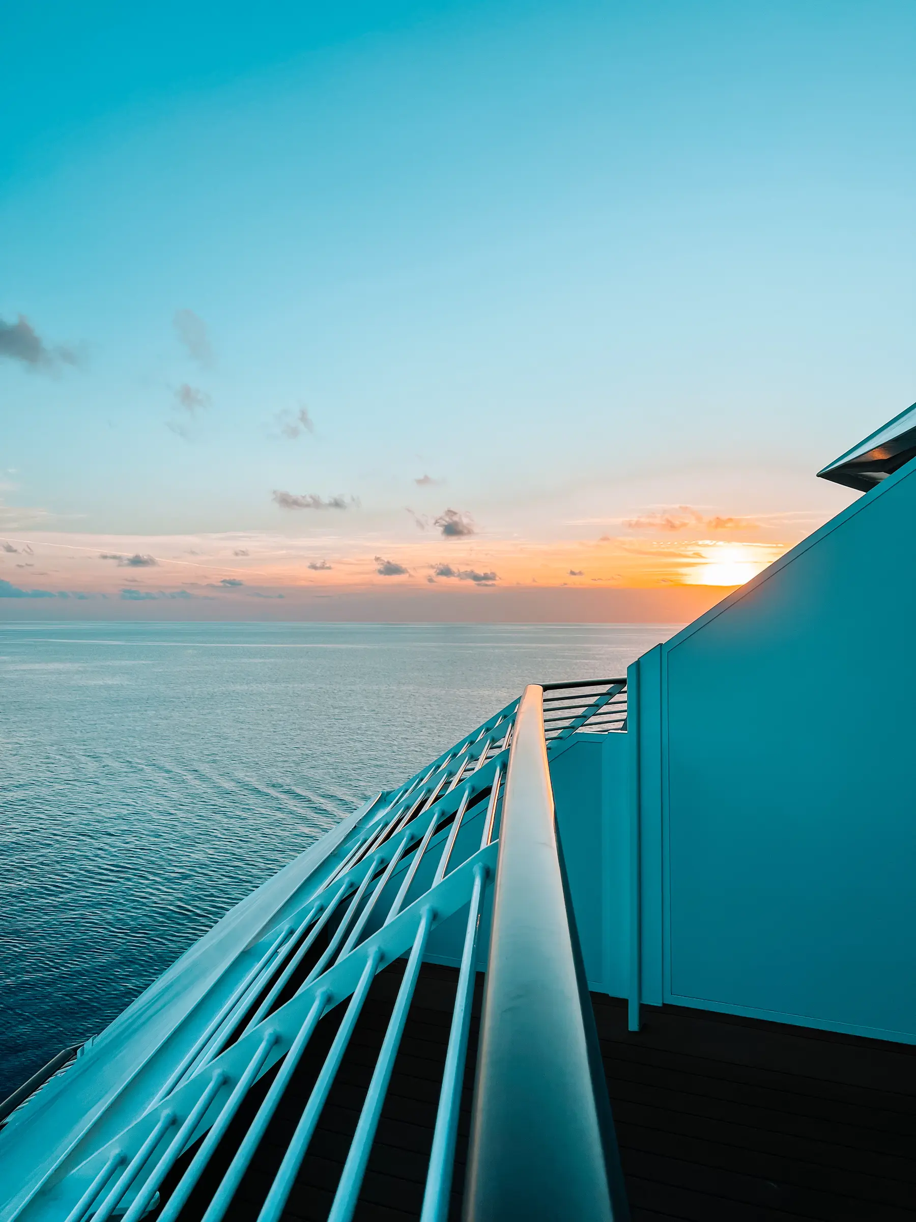 Disney Cruise Line balcony overlooking the ocean at sunset