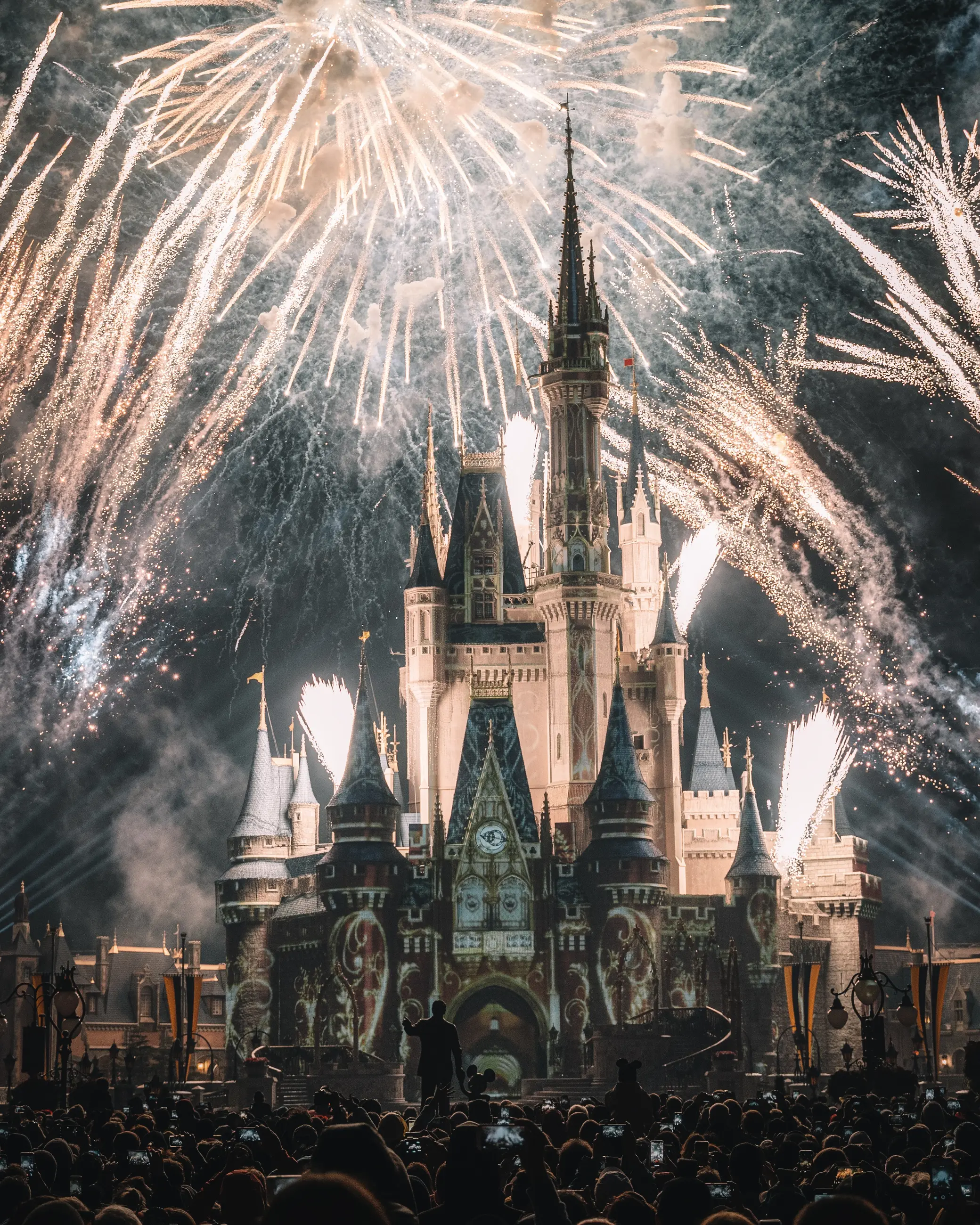 Cinderella Castle surrounded by a brilliant nighttime fireworks display